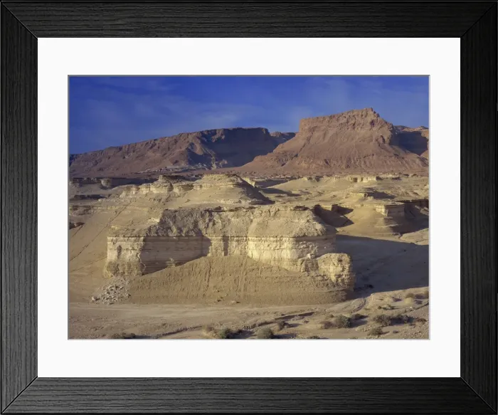 Framed Print : Rock cliffs and sand dunes in front of the fortress of Masada, in the Judean Desert Framed Print : Rock cliffs and sand dunes in front of the fortress of Masada, in the Judean Desert