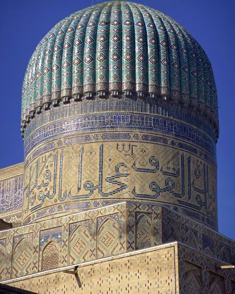 The ribbed dome, tiles and Arabic script on the Bibi Khanym Mosque in Samarkand