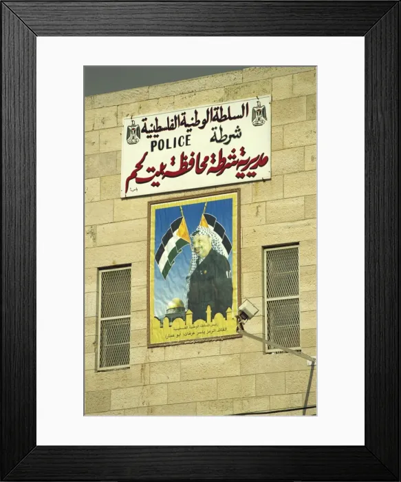 Framed Print : Poster showing Yasser Arafat on the wall of a Palestinian Police Station in Bethlehem Framed Print : Poster showing Yasser Arafat on the wall of a Palestinian Police Station in Bethlehem