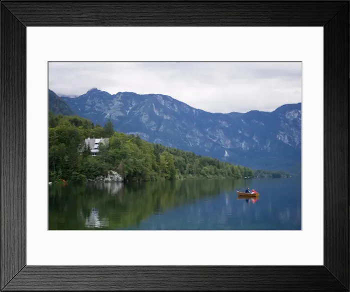 Framed Print : Couple fishing from a boat, Lake Bohinj, Slovenia, Europe