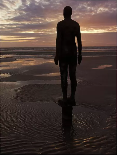 Another Place statues by artist Antony Gormley on Crosby beach, Merseyside