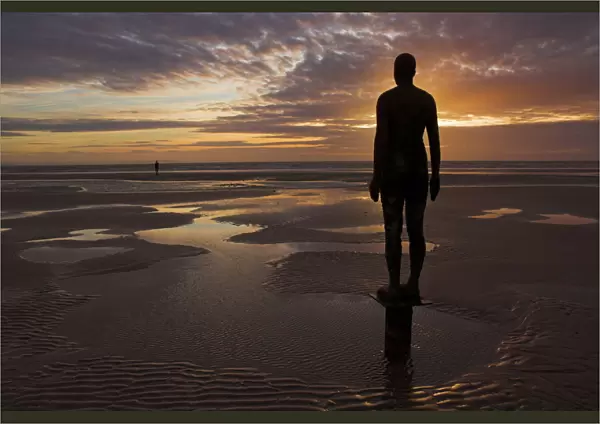 Another Place statues by artist Antony Gormley on Crosby beach, Merseyside