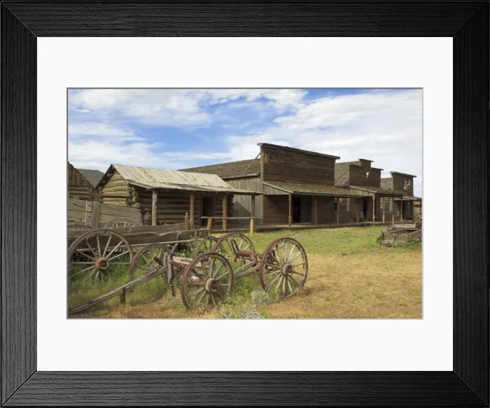 Framed Print : Old western wagons, restored storefronts, homes and saloons from the pioneering days of the Wild West at Cody, Montana, United States of America Framed Print : Old western wagons, restored storefronts, homes and saloons from the pioneering days of the Wild West at Cody, Montana, United States of America
