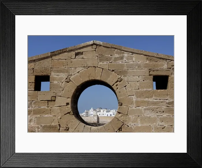 Framed Print : Old waterfront city behind ramparts, Essaouira, historic city of Mogador Framed Print : Old waterfront city behind ramparts, Essaouira, historic city of Mogador