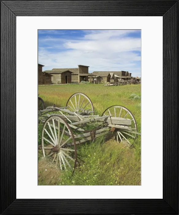 Framed Print : Old western wagons, restored storefronts, homes and saloons from the pioneering days of the Wild West at Cody, Montana, United States of America Framed Print : Old western wagons, restored storefronts, homes and saloons from the pioneering days of the Wild West at Cody, Montana, United States of America
