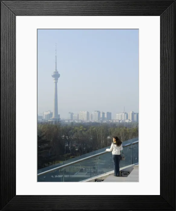 Framed Print : A Chinese girl in front of The CCTV Tower (China Central Television), Beijing Framed Print : A Chinese girl in front of The CCTV Tower (China Central Television), Beijing