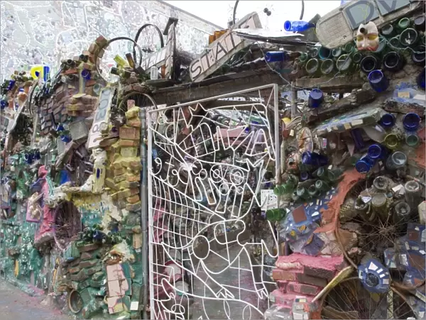 Decoration of patterns in glass, mirrors, ceramics and other fragments of objects embedded in stucco by sculptor Isaiah Zagar, South Street, Philadelphia, Pennsylvania, United States of America