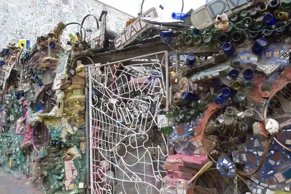Decoration of patterns in glass, mirrors, ceramics and other fragments of objects embedded in stucco by sculptor Isaiah Zagar, South Street, Philadelphia, Pennsylvania, United States of America