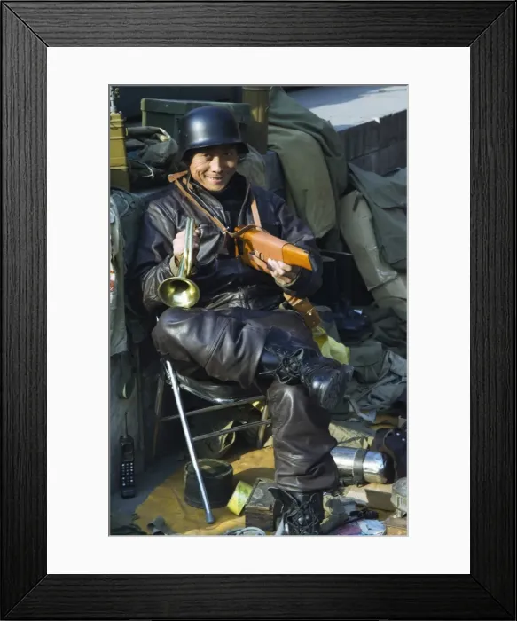 Framed Print : A vendor selling war memorabilia, Baoguo Temple antiques market, Beijing, China, Asia Framed Print : A vendor selling war memorabilia, Baoguo Temple antiques market, Beijing, China, Asia
