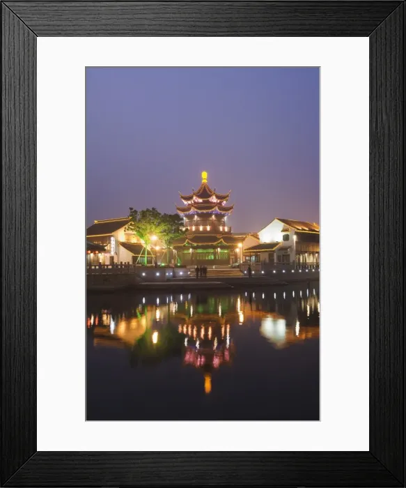 Framed Print : Traditional old riverside houses and pagoda illuminated at night in Shantang water town Framed Print : Traditional old riverside houses and pagoda illuminated at night in Shantang water town