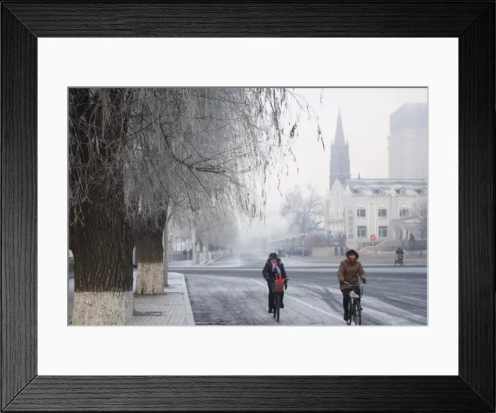 Framed Print : Cyclists in a winter wonderland and Catholic church in Jilin City, Jilin Province Framed Print : Cyclists in a winter wonderland and Catholic church in Jilin City, Jilin Province