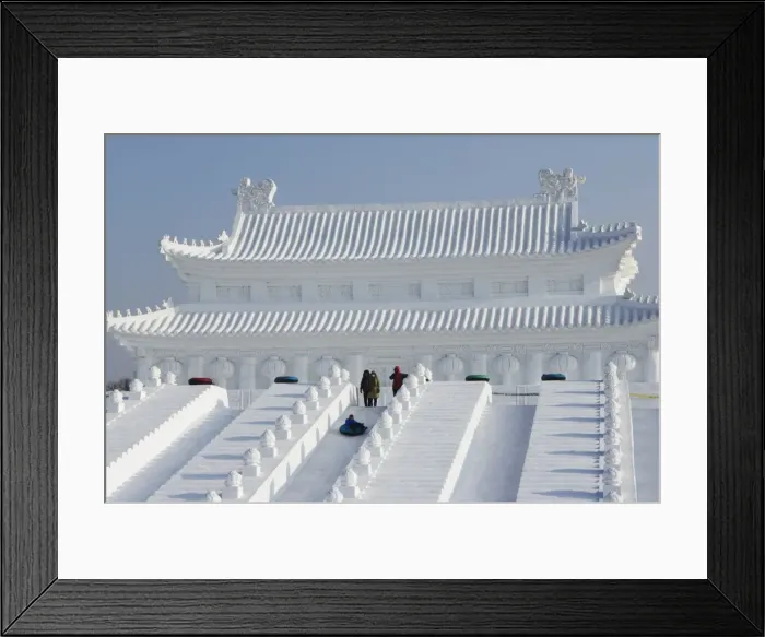Framed Print : A boy slides down a giant replica sculpture of Beijings Forbidden City at the Snow Framed Print : A boy slides down a giant replica sculpture of Beijings Forbidden City at the Snow