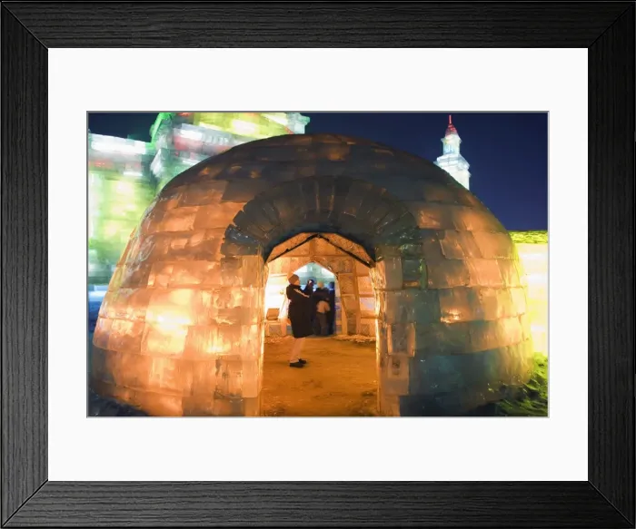 Framed Print : An igloo ice sculpture illuminated at night at the Ice Lantern Festival Framed Print : An igloo ice sculpture illuminated at night at the Ice Lantern Festival