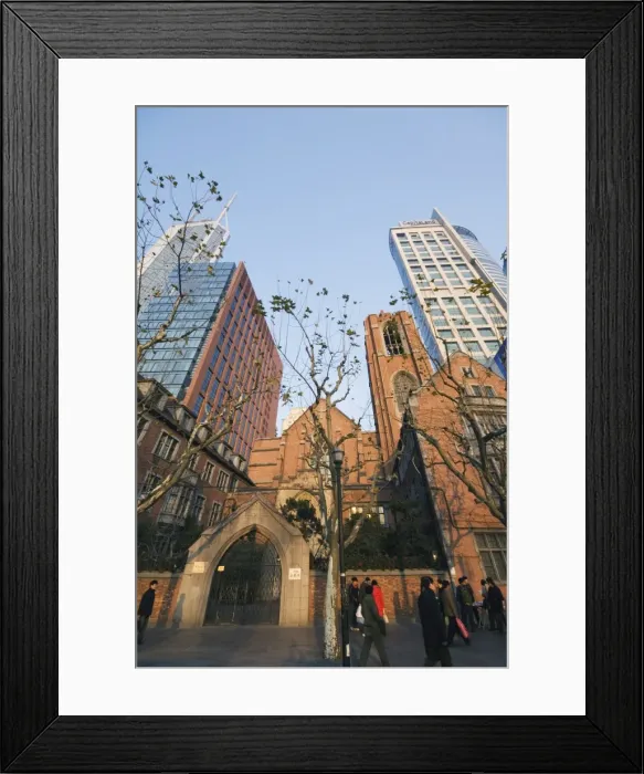 Framed Print : A Christian church among modern skyscrapers on Renmin Square, Puxi area Framed Print : A Christian church among modern skyscrapers on Renmin Square, Puxi area