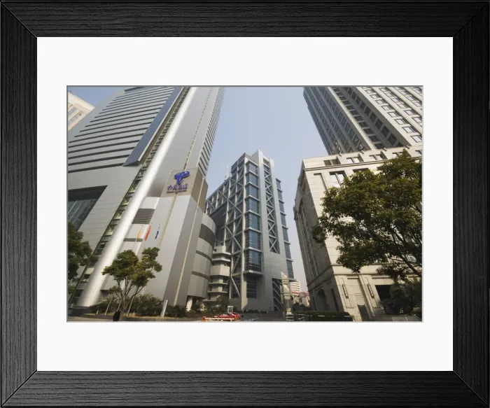 Framed Print : Shanghai Stock Exchange Building surrounded by skyscrapers in Pudong new area Framed Print : Shanghai Stock Exchange Building surrounded by skyscrapers in Pudong new area