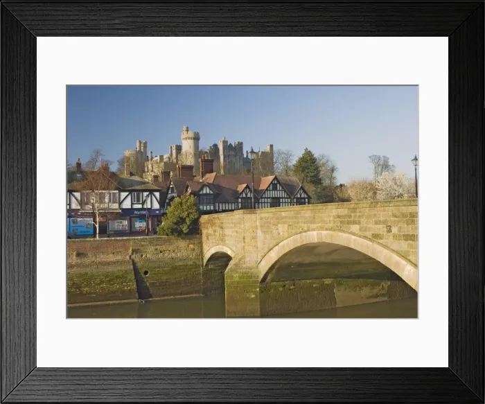 Framed Print : Arundel Castle from across tidal inlet with town bridge with half timbered town houses Framed Print : Arundel Castle from across tidal inlet with town bridge with half timbered town houses