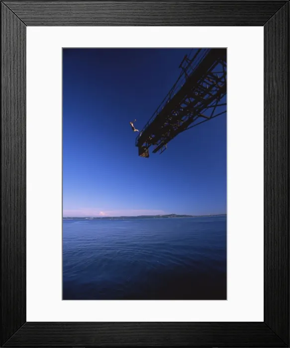 Framed Print : Man jumping from a crane, Washington State, United States of America, North America Framed Print : Man jumping from a crane, Washington State, United States of America, North America
