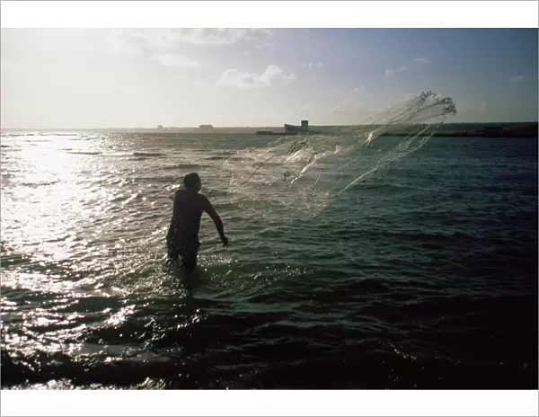 Fisherman casting net, Cuba, West Indies, Central America