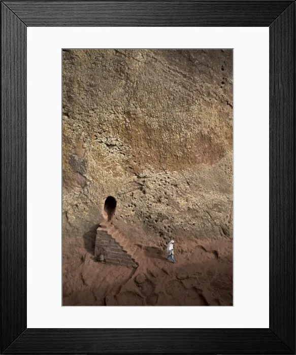 Framed Print : A woman emerges from a tunnel leading to the rock-hewn church of Bet Amanuel Framed Print : A woman emerges from a tunnel leading to the rock-hewn church of Bet Amanuel