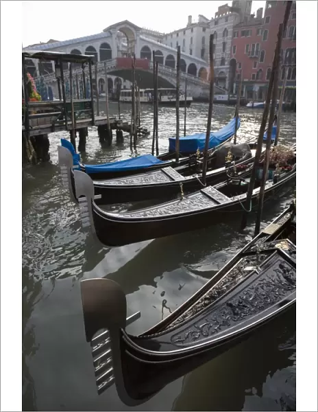 Gondolas moored on Grand Canal near Rialto Bridge, Venice, UNESCO World Heritage Site