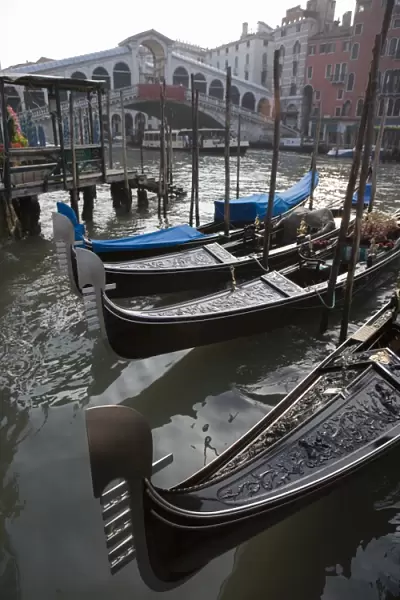 Gondolas moored on Grand Canal near Rialto Bridge, Venice, UNESCO World Heritage Site