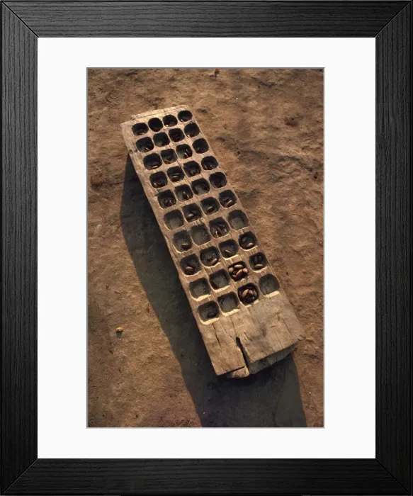 Framed Print : Wooden gaming board (houri) and dried beads, Maridi village, Sudan, Africa Framed Print : Wooden gaming board (houri) and dried beads, Maridi village, Sudan, Africa