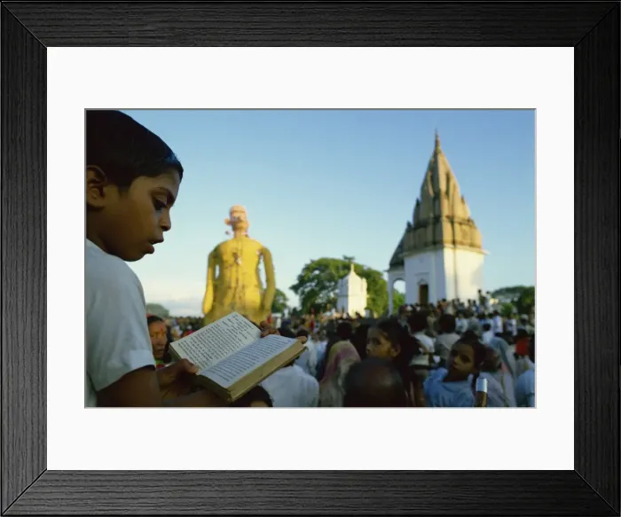Framed Print : Boy follows by reading the text of the Ramlilla, the stage play of the Hindu epic the Ramayana Framed Print : Boy follows by reading the text of the Ramlilla, the stage play of the Hindu epic the Ramayana