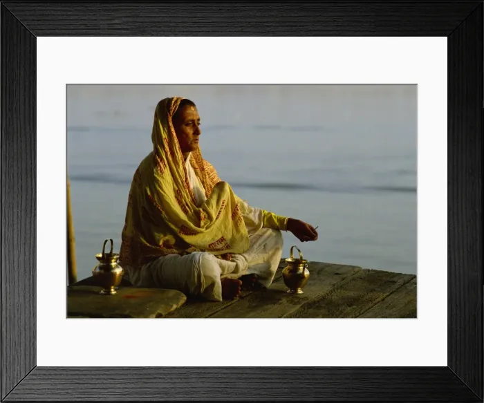 Framed Print : Woman meditating on the banks of the River Ganges, Varanasi, Uttar Pradesh state Framed Print : Woman meditating on the banks of the River Ganges, Varanasi, Uttar Pradesh state
