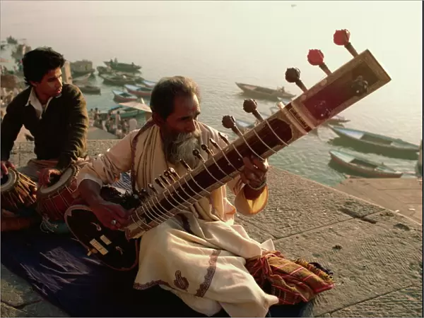 Sitar and tabla player beside the Ganga River, Varanasi, Uttar Pradesh state, India, Asia