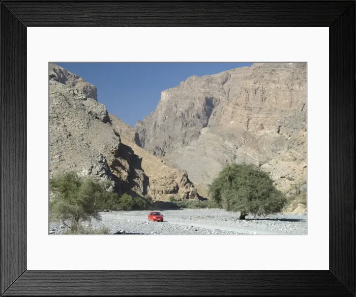 Framed Print : Gravel road along the floor of deep wadi below limestone cliffs, Wadi Bani Habib Framed Print : Gravel road along the floor of deep wadi below limestone cliffs, Wadi Bani Habib