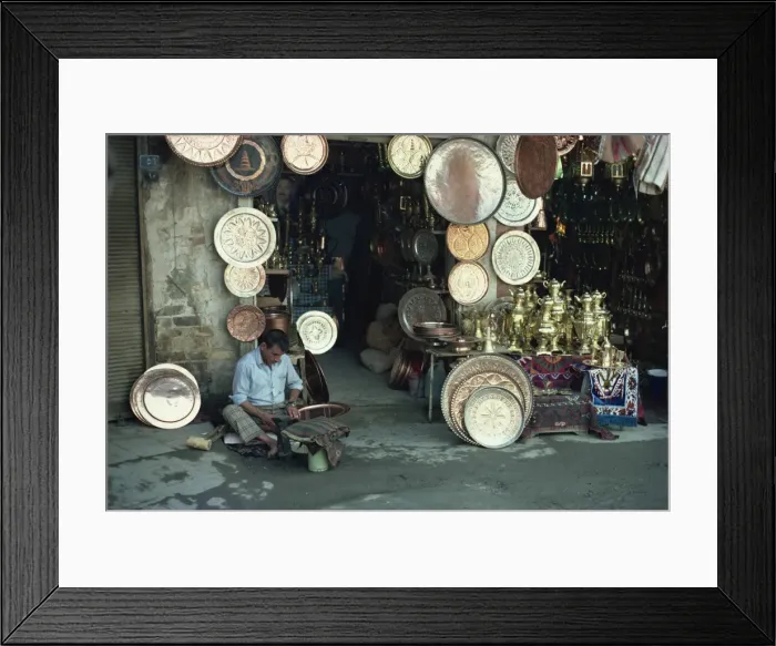 Framed Print : Man working on copper plate outside a copper souk, Baghdad, Iraq, Middle East Framed Print : Man working on copper plate outside a copper souk, Baghdad, Iraq, Middle East