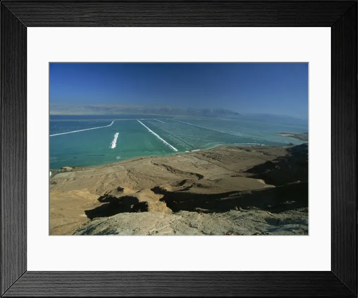 Framed Print : The shallow south end of the Dead Sea where salt deposits left by massive evaporation are mined Framed Print : The shallow south end of the Dead Sea where salt deposits left by massive evaporation are mined