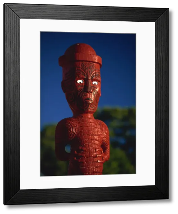 Framed Print : A carved figure or poupou in a Maori village at the Whakarewarewa thermal Framed Print : A carved figure or poupou in a Maori village at the Whakarewarewa thermal