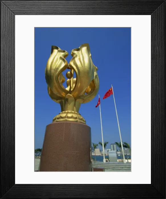Framed Print : Sculpture and the Chinese flags flying at the Hong Kong Convention and Exhibition Centre Framed Print : Sculpture and the Chinese flags flying at the Hong Kong Convention and Exhibition Centre