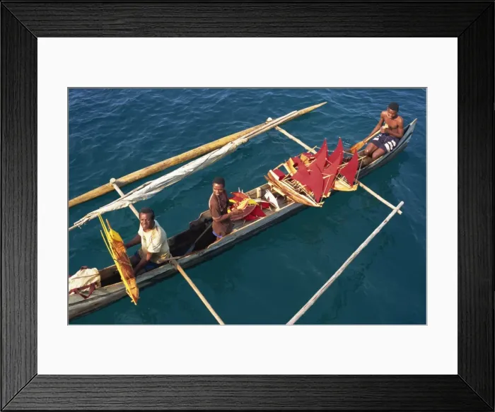 Framed Print : Men in outrigger canoes selling model boats with red sails, Nosy Be, Madagascar, Africa Framed Print : Men in outrigger canoes selling model boats with red sails, Nosy Be, Madagascar, Africa