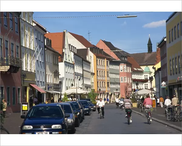 Cycling through town, Freising, Bavaria, Germany, Europe
