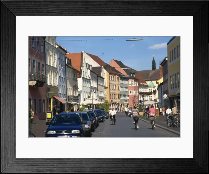 Framed Print : Cycling through town, Freising, Bavaria, Germany, Europe Framed Print : Cycling through town, Freising, Bavaria, Germany, Europe