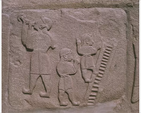 Copy at archaeological sites of Hittite relief showing sword swallowers and acrobats
