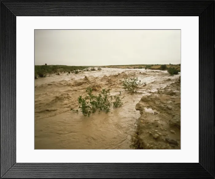Framed Print : Flash flood in oued (river bed) in normally dry Algerian Sahara region Framed Print : Flash flood in oued (river bed) in normally dry Algerian Sahara region