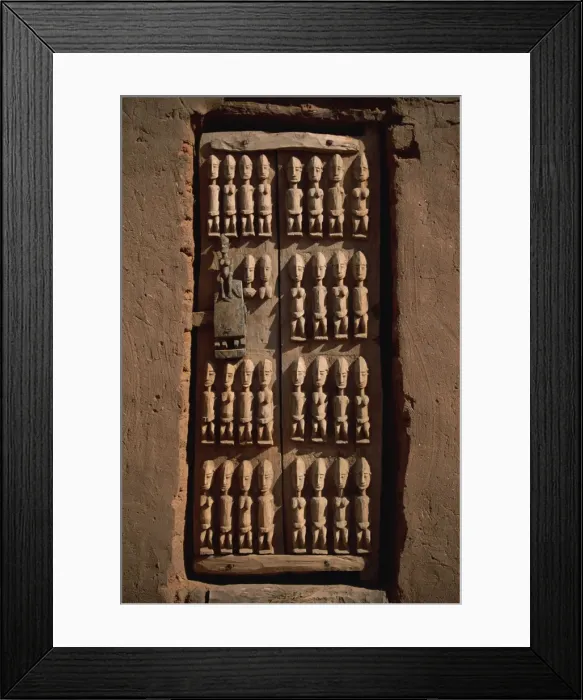 Framed Print : Close-up of granary door depicting ancestors of the Dogons, village in the Dogon area Framed Print : Close-up of granary door depicting ancestors of the Dogons, village in the Dogon area