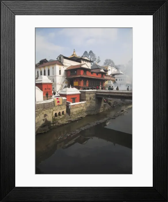 Framed Print : Smoke rising from cremation ceremony on banks of Bagmati River during Shivaratri festival Framed Print : Smoke rising from cremation ceremony on banks of Bagmati River during Shivaratri festival