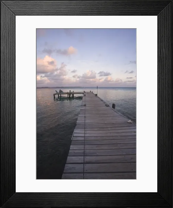 Framed Print : People sitting on chair on jetty at sunrise, Tobaco Caye, Belize, Central America Framed Print : People sitting on chair on jetty at sunrise, Tobaco Caye, Belize, Central America