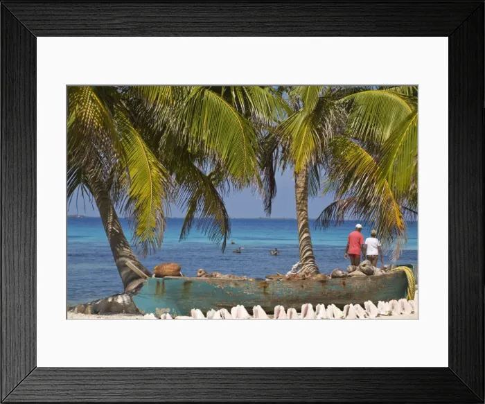 Framed Print : Shells in front of canoe filled with coconut husks, Laughing Bird Caye