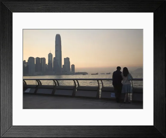 Framed Print : Couple looking at Victoria Bay and city skyline at sunset, Hong Kong, China, Asia Framed Print : Couple looking at Victoria Bay and city skyline at sunset, Hong Kong, China, Asia