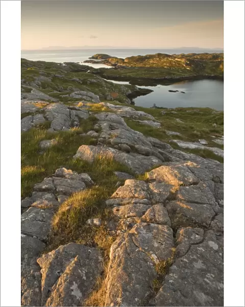 Rocky coasline bathed in early morning light at township of Manish, Isle of Harris