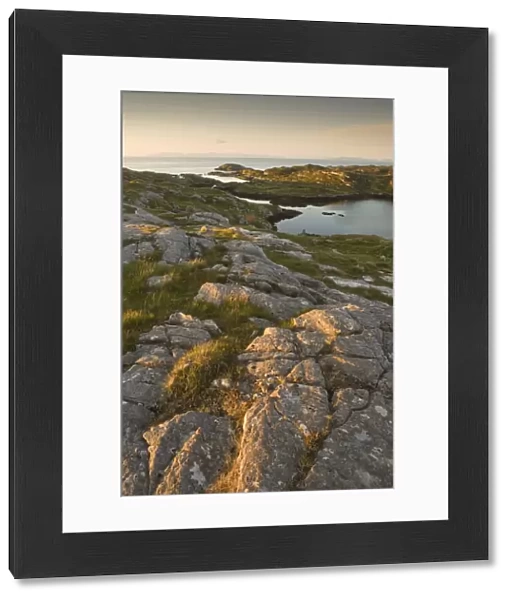 Rocky coasline bathed in early morning light at township of Manish, Isle of Harris