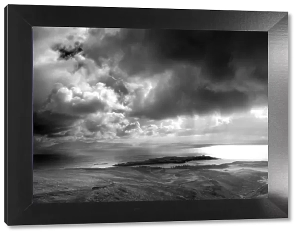 Panoramic view from An Sgurr on the Isle of Eigg, looking towards a storm over the sea between Eigg
