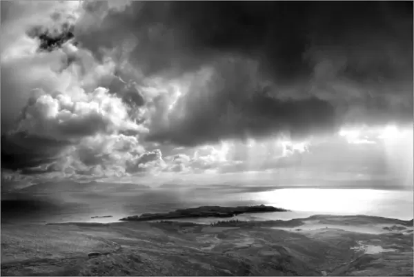 Panoramic view from An Sgurr on the Isle of Eigg, looking towards a storm over the sea between Eigg