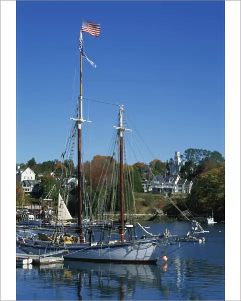 Traditional boat flying the Stars & Stripes, moored in the harbour at Rockport