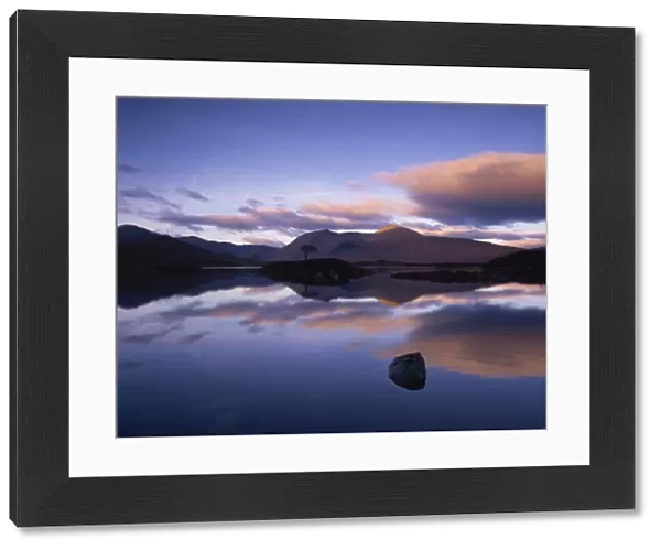 Reflections in Loch Achlaise of clouds and dark hills of Rannoch Moor, in the Highland Region of Scotland, United